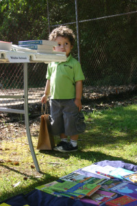 A child carries a bag with a take-home book at Day of the Book.