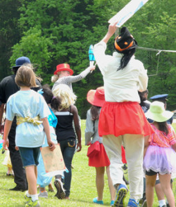 Kids and adults participate in a Joyful Parade at Day of the Book.