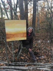Sarah Graham in the woods with her work. Photo by Heather Jester.