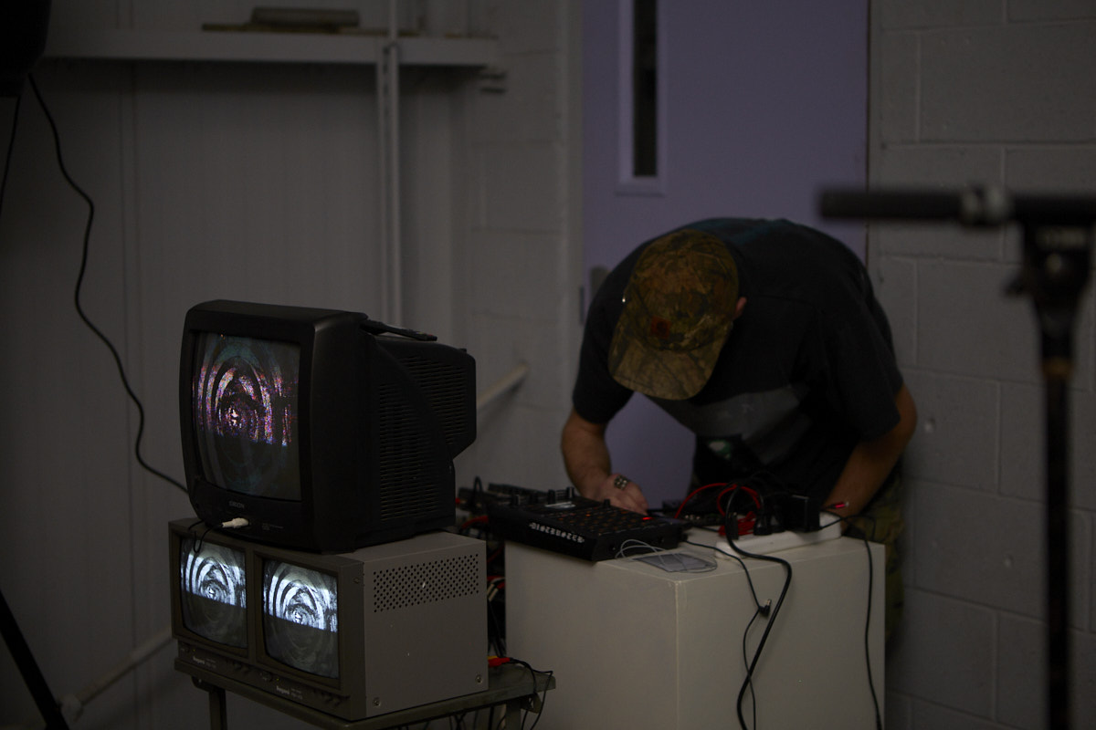 Photo of sound artist Caleb McLaurin aka skintape presenting his newest installation