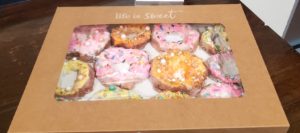 Pop art donuts created by fourth-grade class from mixed media materials.