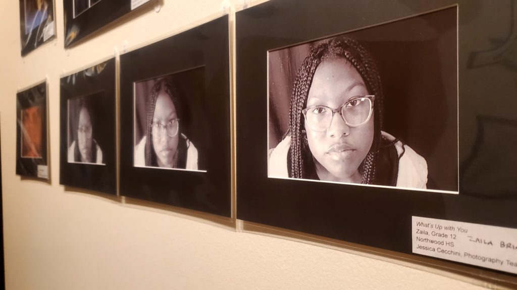 Two black and white self-portrait photographs of a young Black woman with glasses.