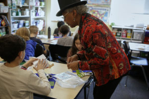 Photo of Willa assisting student