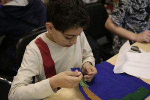 Photo of student sewing