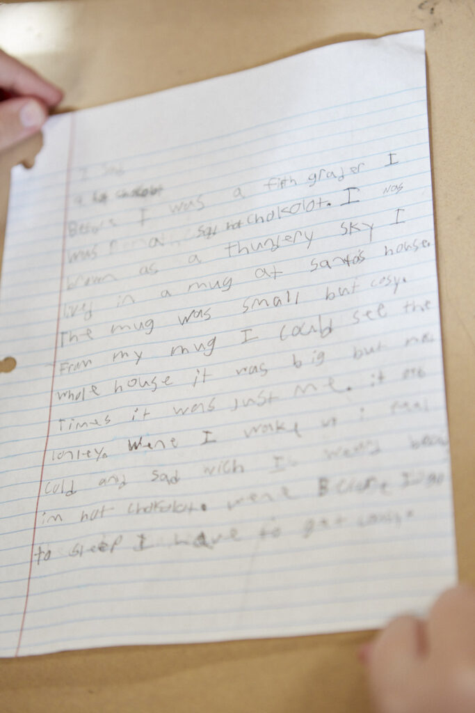 Photo of student's writing on white notebook paper