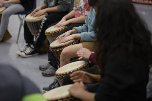 Photo of kids' hands on drums