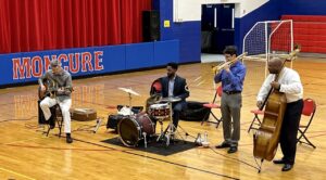 Photo of John Brown Band performing in the Bennett School gym