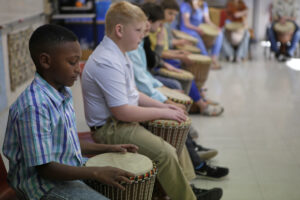 Students holding their djembe drums