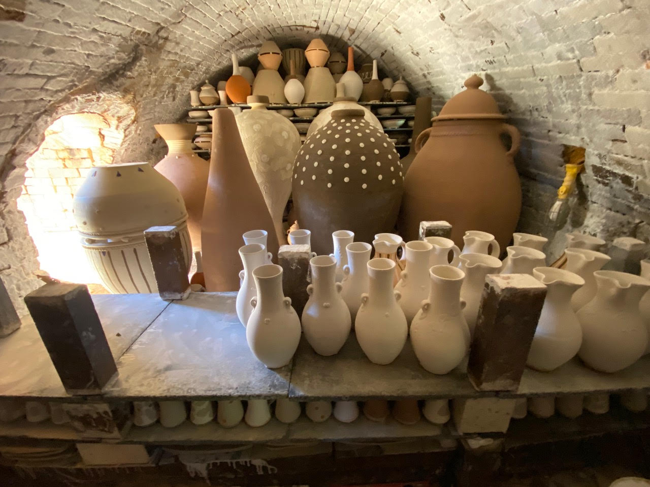 a storeroom filled with ceramics of varied size.