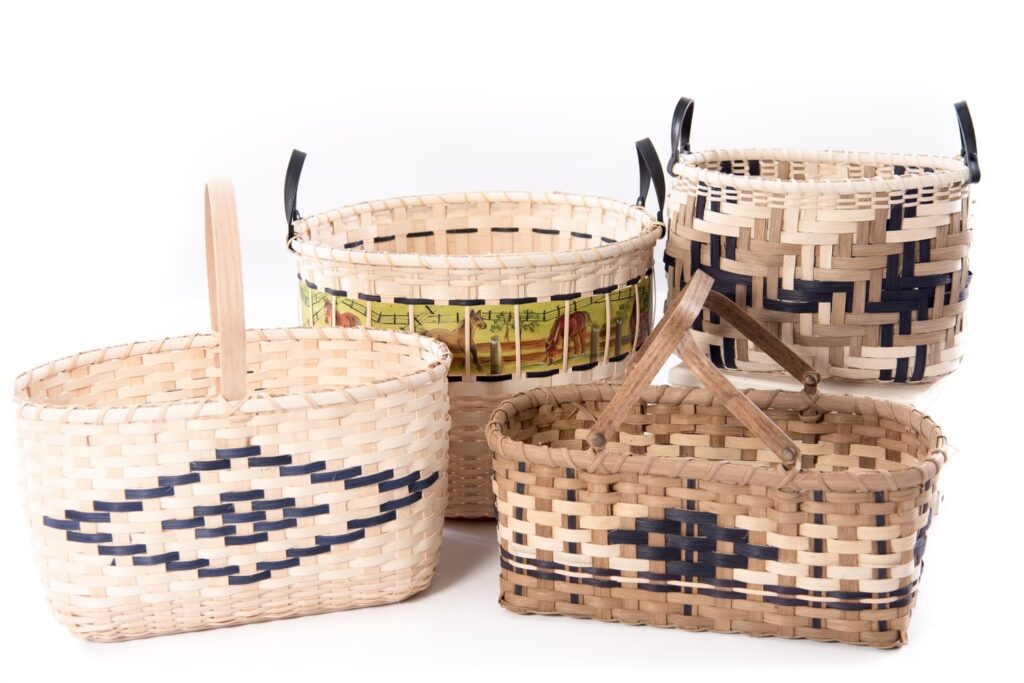 a grouping of four baskets woven in a variety of colors.