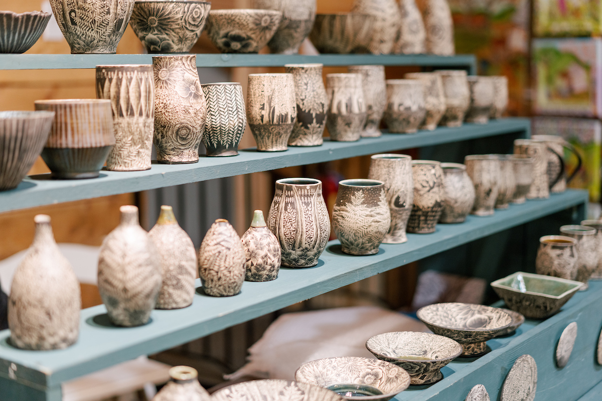 a display of ceramics in beige and faded blue