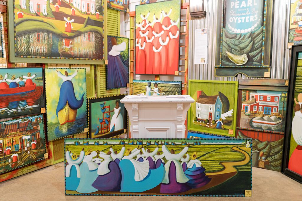 brightly colored painting mounted on a green wall