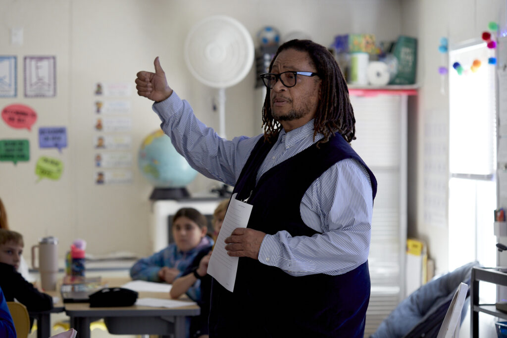 Poet Phillip Shabazz instructs a class of fifth grade students on poetry writing.