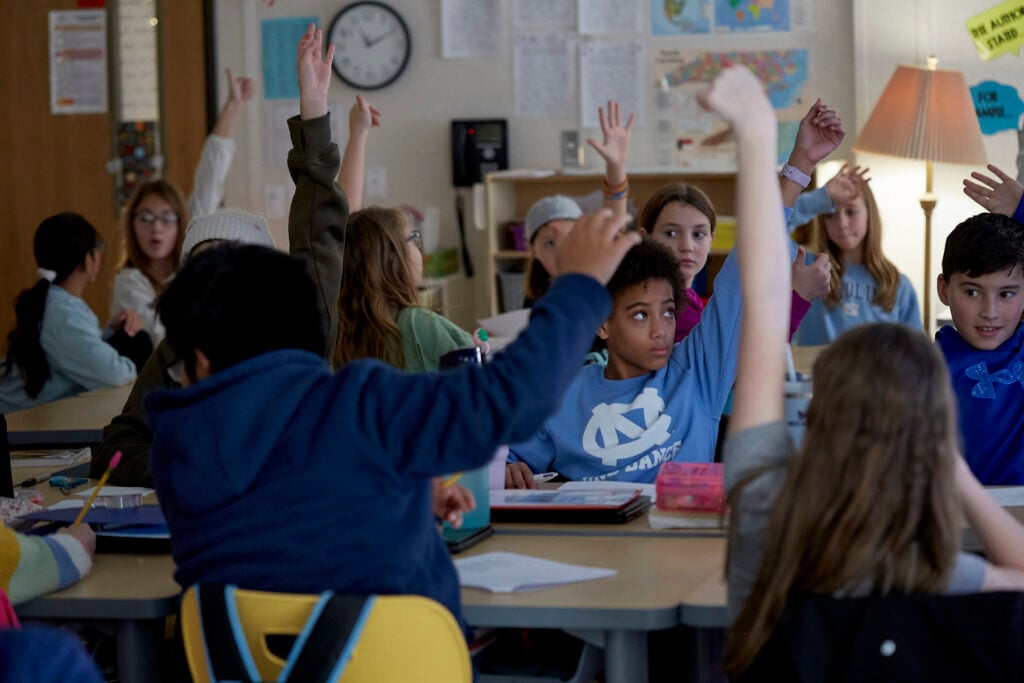 Poet Phillip Shabazz instructs a class of fifth grade students on poetry writing.