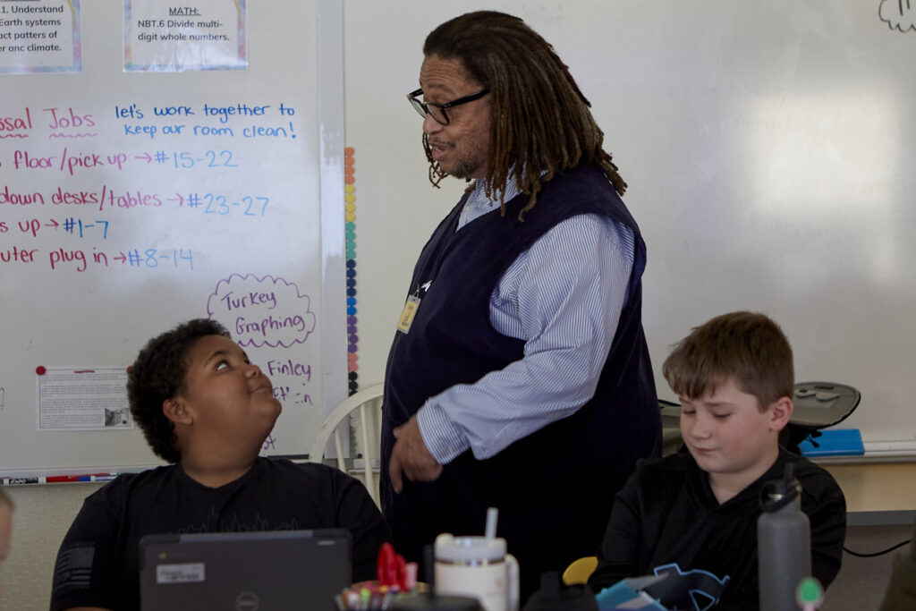 Poet Phillip Shabazz instructs a class of fifth grade students on poetry writing.