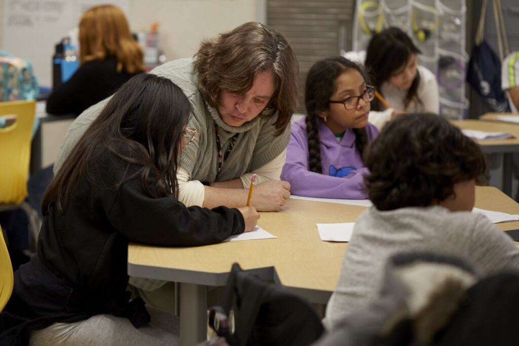 Poet Phillip Shabazz instructs a class of fifth grade students on poetry writing.