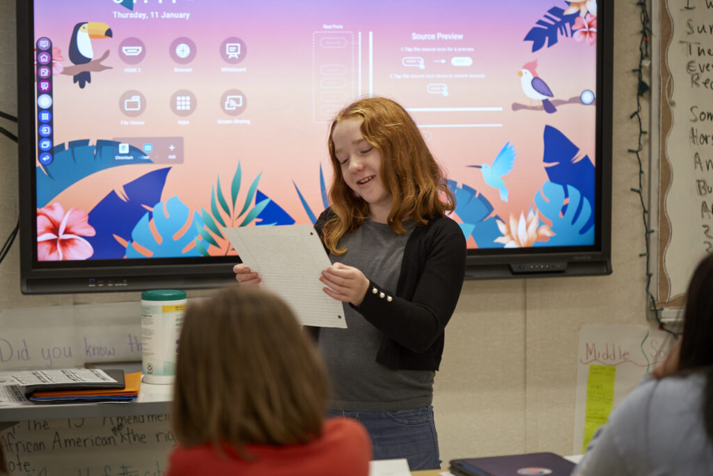 Poet Phillip Shabazz instructs a class of fifth grade students on poetry writing.