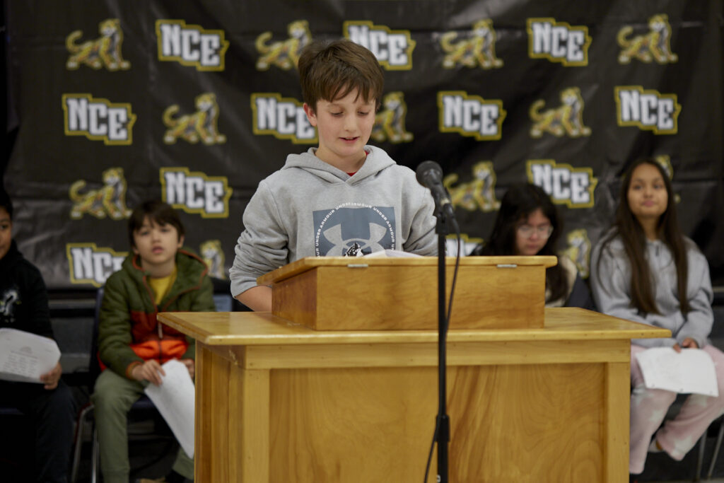 Poet Phillip Shabazz instructs a class of fifth grade students on poetry writing.