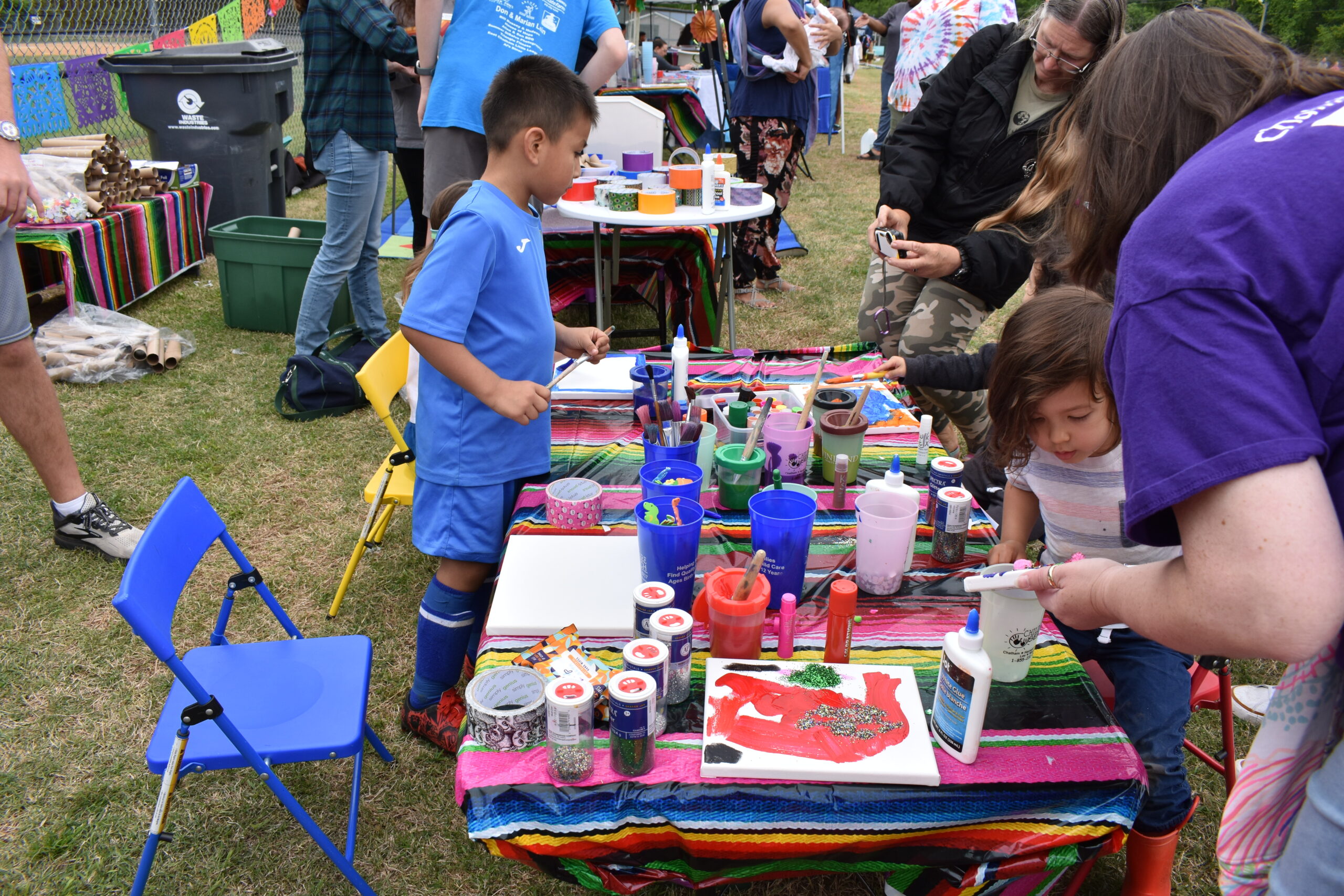 Children painting at an art table