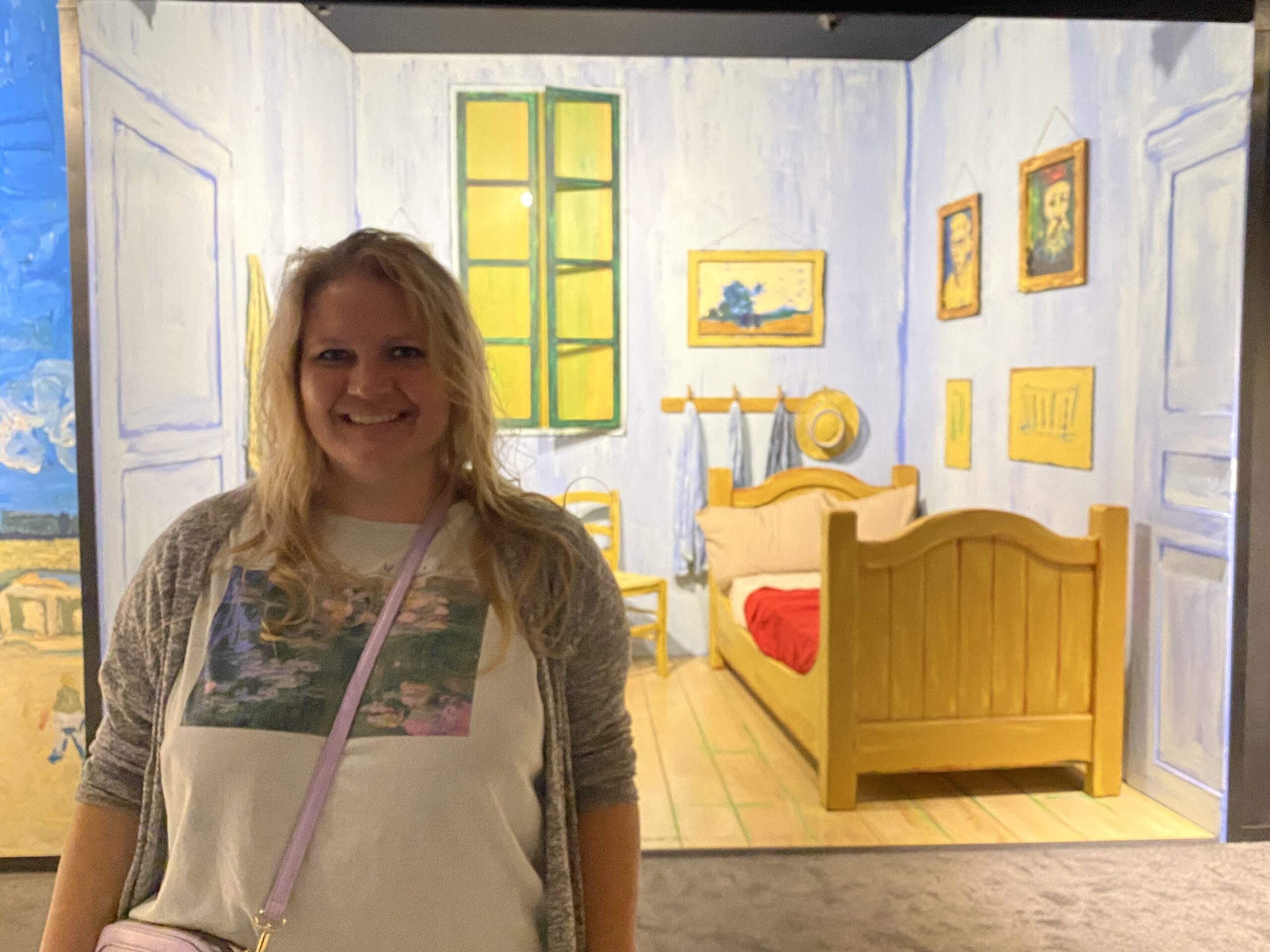 a woman in front of a painting