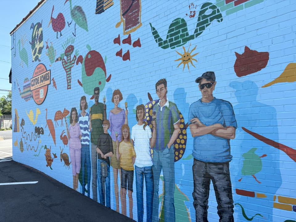 Clyde Jones mural featuring critters and people