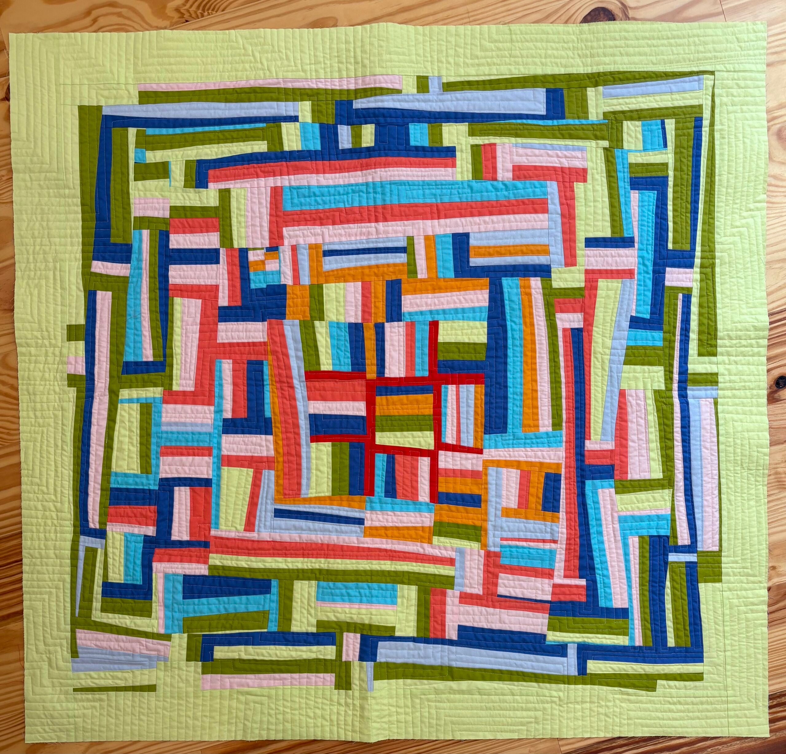 multicolored, geometric quilt top
