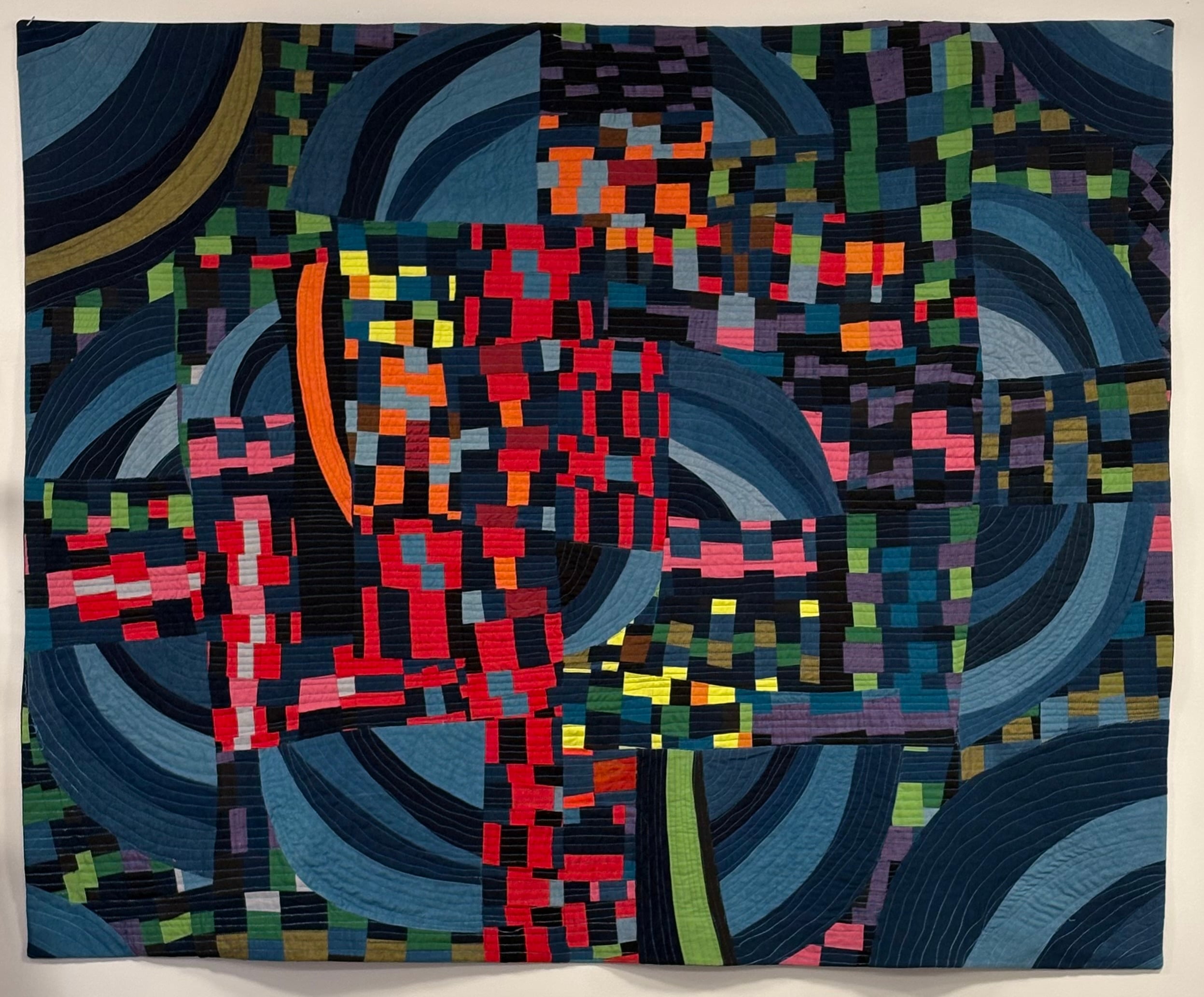 a multicolored, geometric quilt top