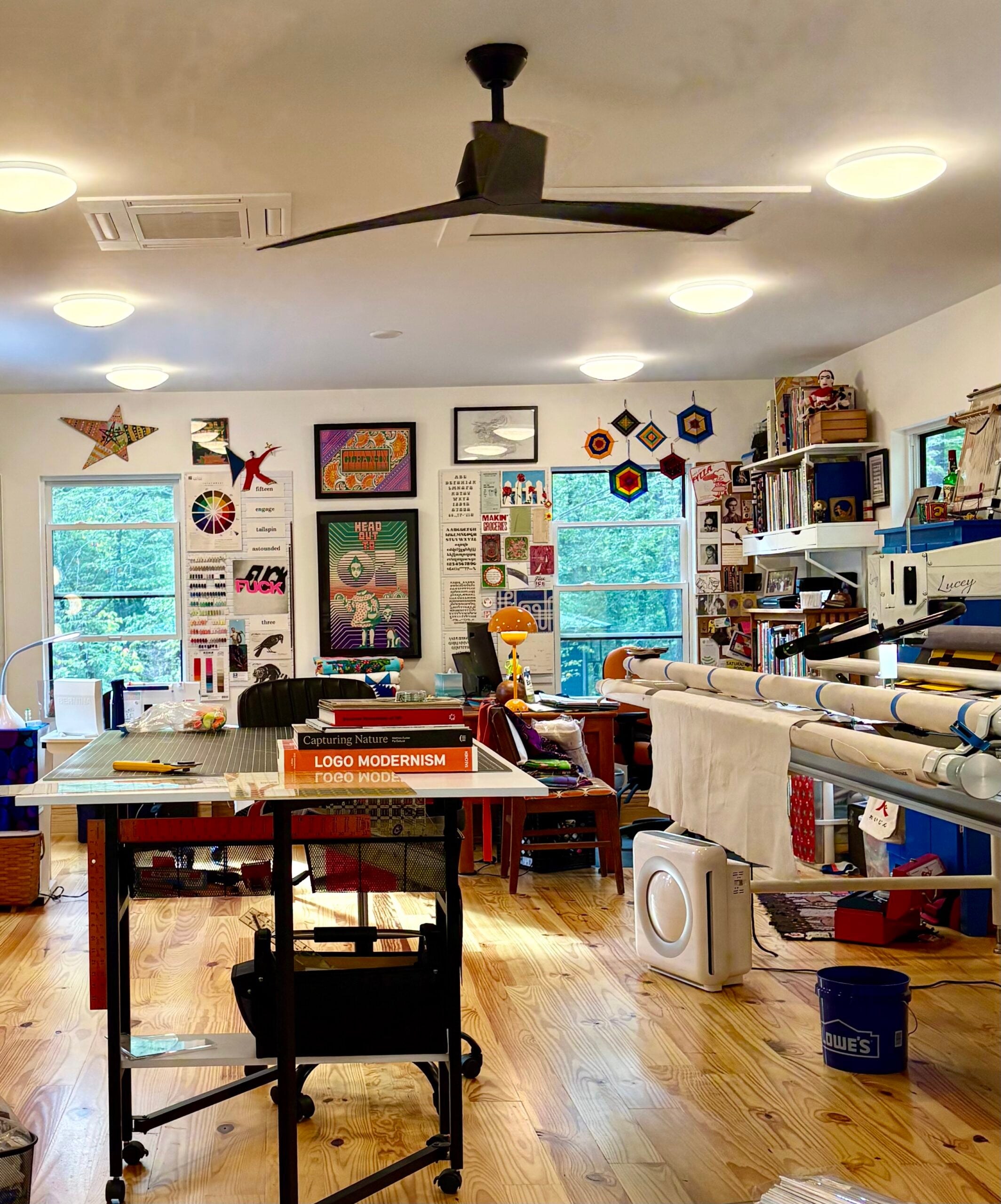 a brightly lit fabric arts studio.
